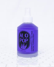 Load image into Gallery viewer, Chamomile + Tea Tree Toning Mist in a glass mist bottle. Liquid is purple and the label has the ALOPOP logo and title of this gentle face toning mist in black. The bottle is sitting on white tile with a white background.