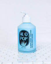 Load image into Gallery viewer, Glass bottle of Elderflower and Avocado Facial Moisturizer, creamy cyan blue lotion with a white pump top lid. Blue label with black ALOPOP logo and product title.  Gentle moisturizer is sitting on white geometric tiles with a white background.